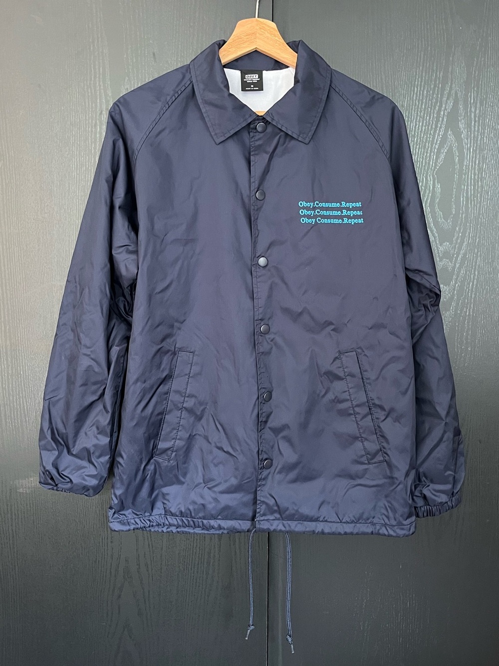 Obey Navy Windbreaker Jacket with Teal Logo